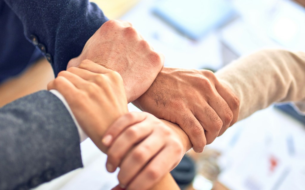 Hands joined together in teamwork